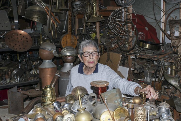 Mount Pleasant resident Rose Wunderbaum Traines looks through various pieces of metal in her garage.