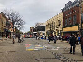 Community members gathered during the grand opening block party for Sleepy Dog Books.