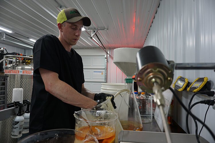 Andrew Breternitz, laboratory supervisor, has been with Ag Marvels for almost a year. Here, he’s creating isolates. Once the solids are scraped out, washed, and filtered, they’ll be dried into a fine powder in a vacuum oven.