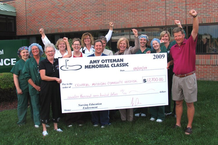 A check presentation in 2009, giving $17,700 to Central Michigan Community Hospital (now McLaren Central Michigan).