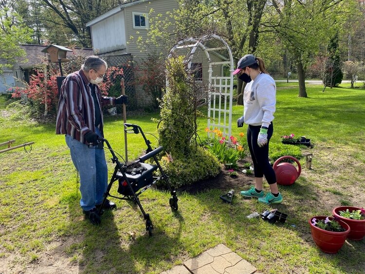 Kayla Susko in the yard where she planted. 