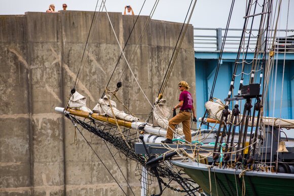 James Rogers, 19, from Rhode Island, helps dock the Denis Sullivan. James is with the Tall Ships America organization.