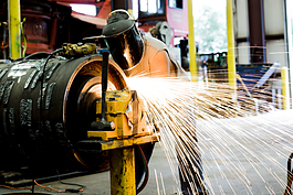 An employee at work at Bandit Industries outside Remus, Michigan