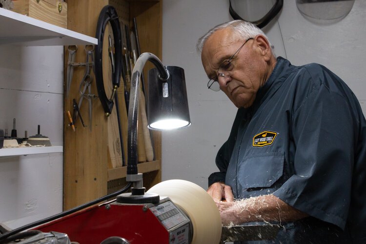 Frank Tiahrt demonstrates how he carves out the center of a bowl.