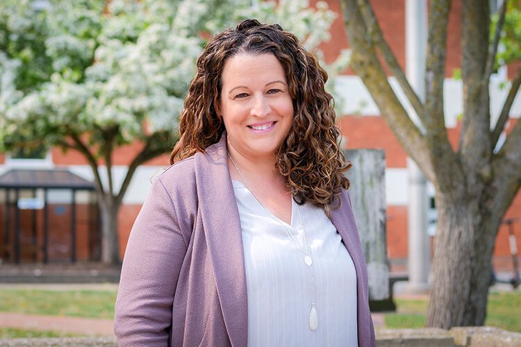 Angie Evans poses for a photograph in Downtown Mt. Pleasant after recently being awarded 2023’s The Good Prize from United Way of Gratiot and Isabella Counties. (Photo: Courtney Jerome/Epicenter)