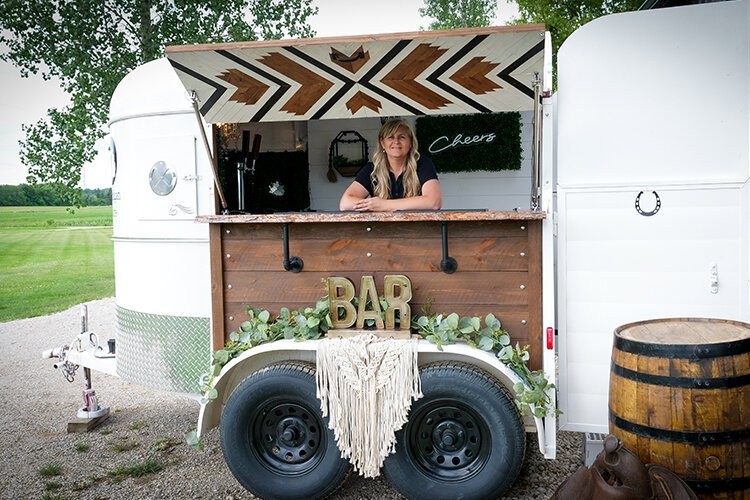 Entrepreneur Shari Myers opens the Michigan Mare mobile bar, a new inventory addition to Something Borrowed Event Rental in Shepherd, Michigan. 