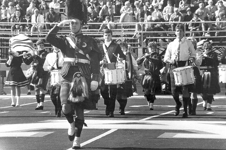 Historic image of the Kiltie Marching Band performing at Alma College.