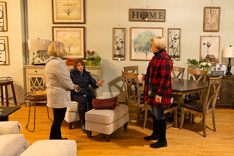 Barb Schaedler, Joice Joslin, and Cheryl Warson chat about furniture at Gray’s Furniture and Boutique during the Ladies’ Day Out event in downtown Mt. Pleasant, Saturday, Nov. 12. (Photo: Addy Wachter/Epicenter)