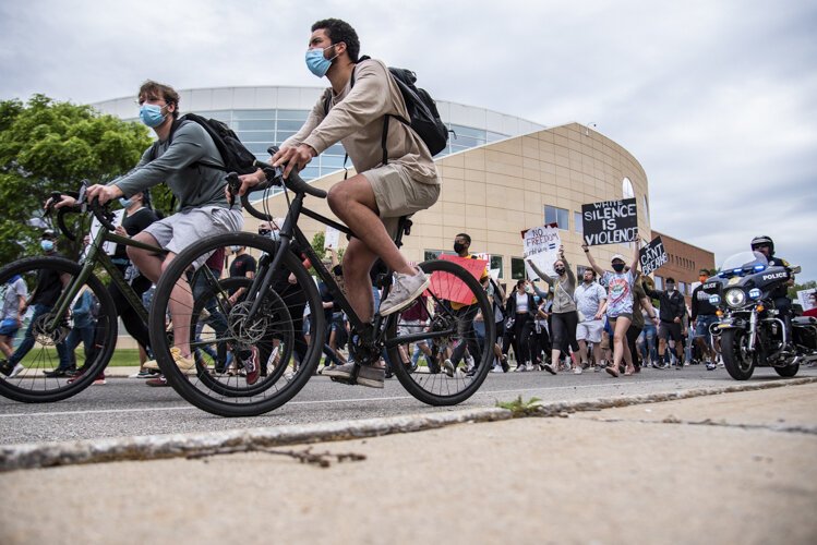 Protestors start their march to protest the death of George Floyd and social injustice June 1 outside Charles V. Park Library in Mt. Pleasant, MI.