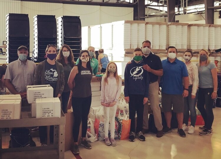 The Great Lakes Bay Regional Alliance and volunteers at the Dow Hangar dropping materials off for distribution.