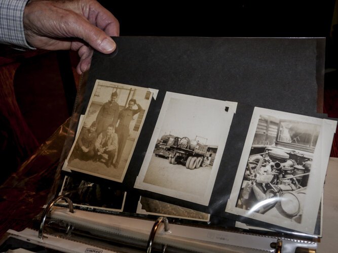 WWII veteran Ed Haynack shows photos from his time in the Army while he was in Japan.