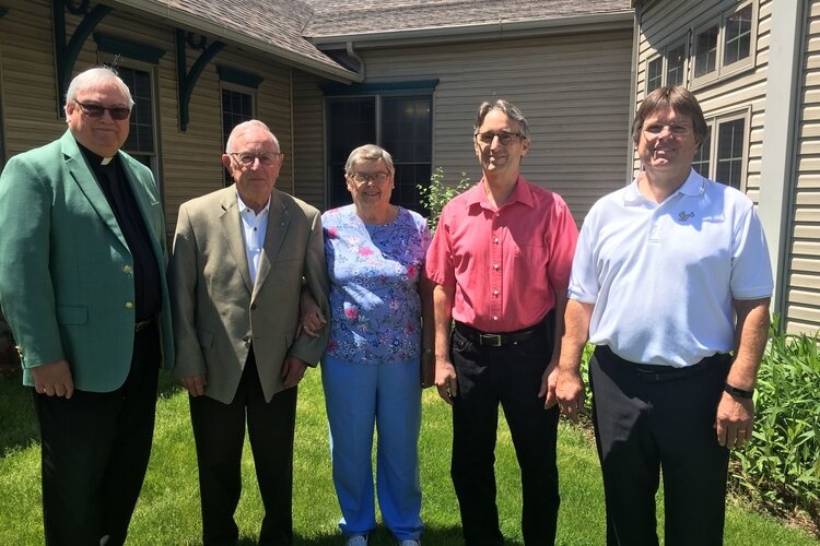Taken the day Don Hire discovered he would receive the Bishop Murphy Award. From left: Reverend Loren Kalinowski, Don Hire,  Dorothy Hire (Don’s wife), and  their sons, Jim Hire and Dave Hire.