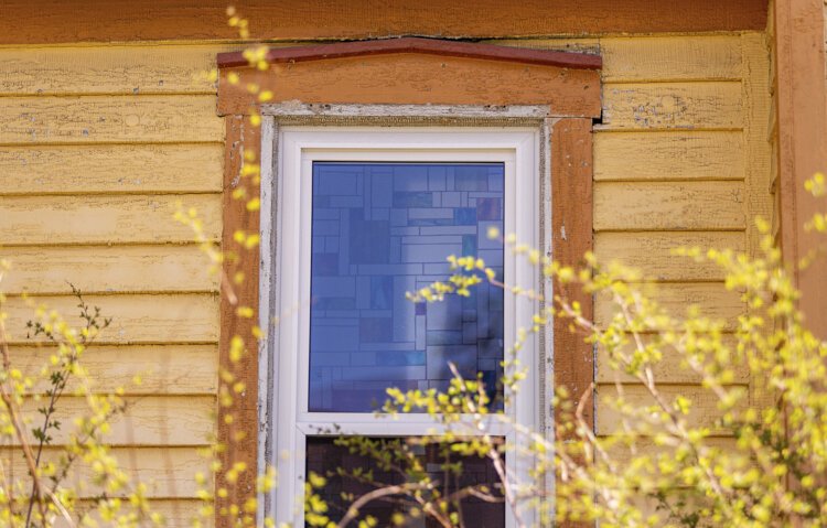 Stained glass can be found in the windows of the Doughty House. 