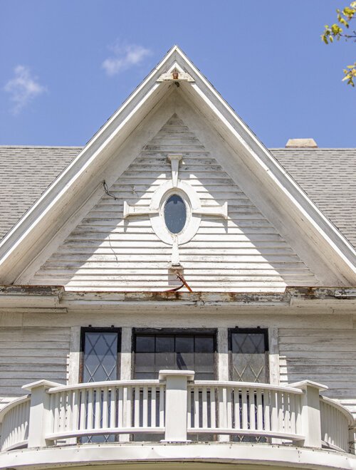 The details within and surrounding the windows of 301 East High Street vary in both design and materials.