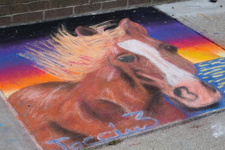 Chalk the Walk artworks adorned the sidewalks downtown between Main and University Street in Mt. Pleasant.