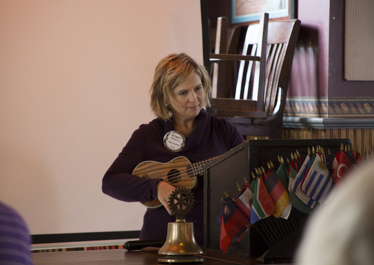 President Elect of the Mt. Pleasant Rotary Club, Bethany Ervin, plays Johnny Cash's "Burning Ring of Fire" on the ukulele during the Mt. Pleasant Rotary Club's meeting at Mountain Town Station on Monday, Oct. 8, 2018.