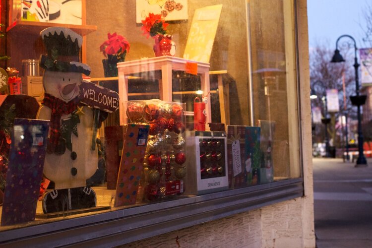 Christmas decorations are displayed in a window in downtown Mt. Pleasant.