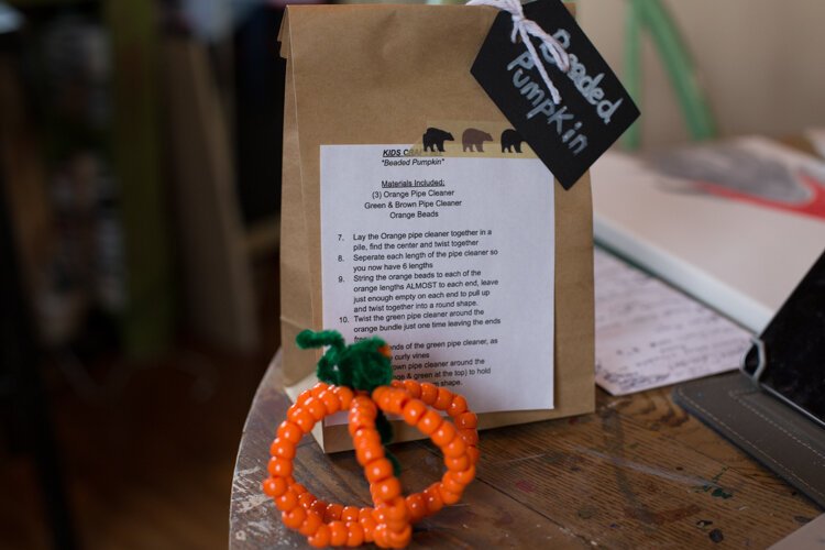 A kids craft for a beaded pumpkin is part of Mama Bair Art's Take & Make offerings.