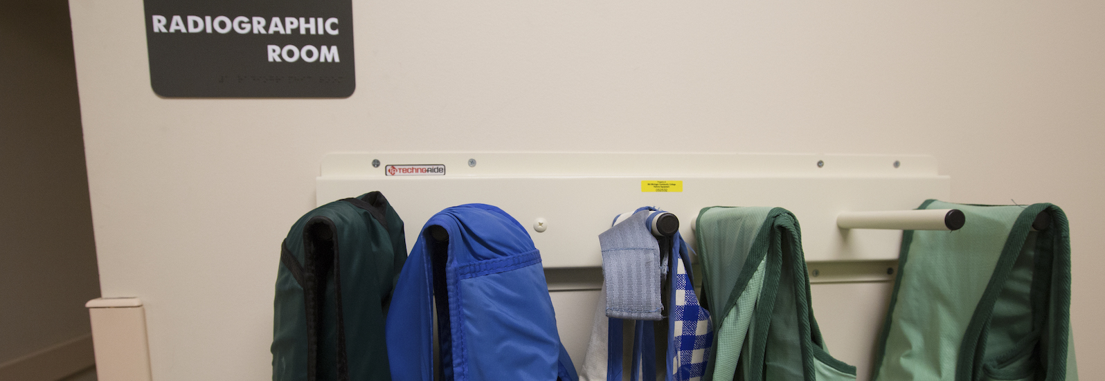 X-ray garments hang outside the radiographic room at the Center for Medical Imaging Studies on the Mid Michigan College Harrison campus on Friday, Jan. 18, 2019.