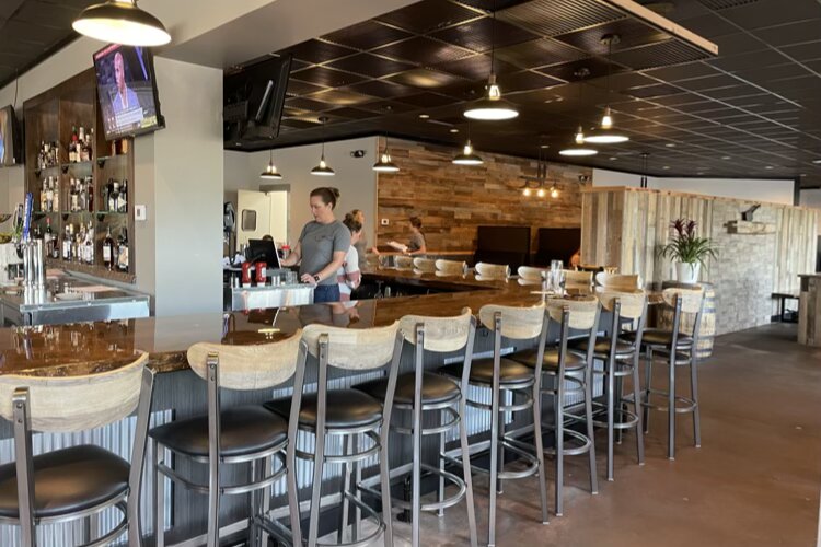 The restaurant's interior is a mix of wood and metal elements.