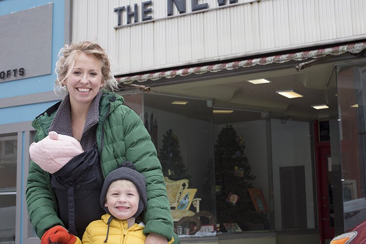 For Arts Sake co-founder Megan Bair, of Mama Bair Art, poses for a photo with her 3-year-old son Roman and 2-month-old daughter Margot outside of the new mid-Michigan art co-op's location in downtown Mt. Pleasant.