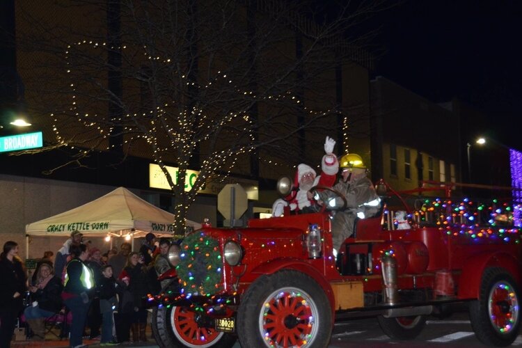 Santa rides through Mt. Pleasant in a fire truck.