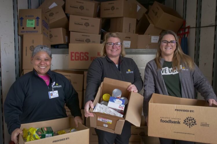 MyMichigan Medical Center Mt. Pleasant employees volunteer at Fill A Mayflower. Left-to-right: Julie Guerrero, Andrea VanAlstine, Carisa Perkins
