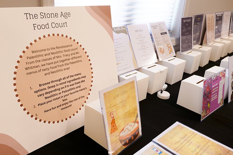 An interactive Stone Age Food Court, where participants were encouraged to vote for their favorite student-designed menus.