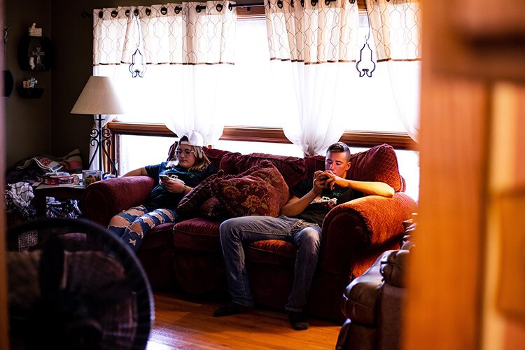 Grace and Aidan join Easton in the living room to rest after a day full of manual labor and interacting with family. 