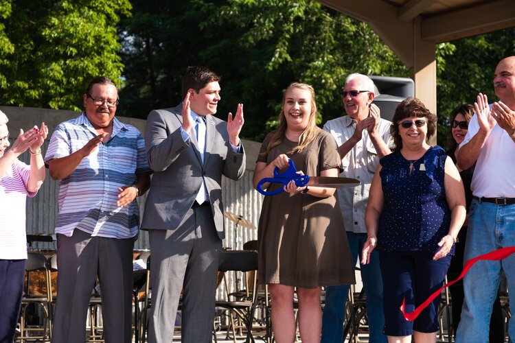 Community leaders celebrate the ribbon cutting of the new Island Park Arts Pavilion. (L-R): Mt. Plea