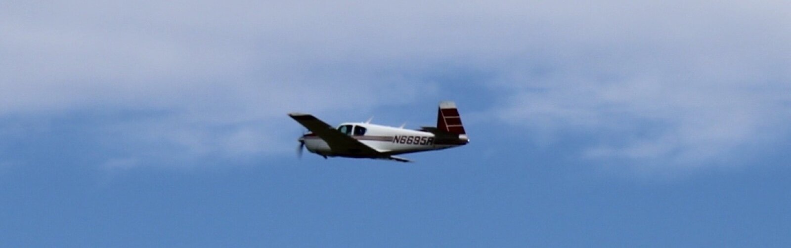 Airplane N6695R takes off in the sky, giving children a 15-20 minute once-in-a lifetime-experience.