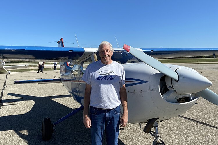 Randy MacDonald, President of EEA Chapter 907, poses in front of an airplane at the Wings and Wheels event on Sept. 18, 2021.