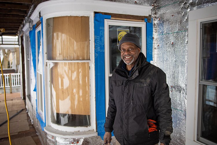 Ken Williams poses for a photo in front of his home at 502 S. University St. which is receiving major renovations.