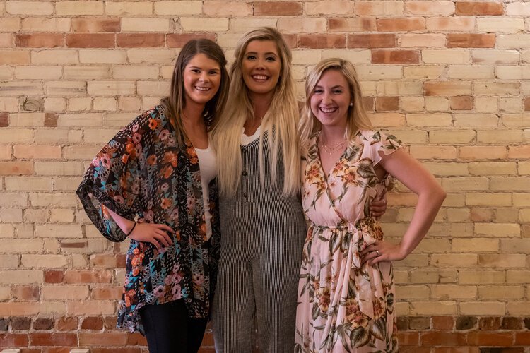 From left to right: Samantha Walters, Morgan Humphrey, and Kelsey Driessnack. Together, they manage the three businesses that make up the 500 District, owned by Morgan Humphrey.