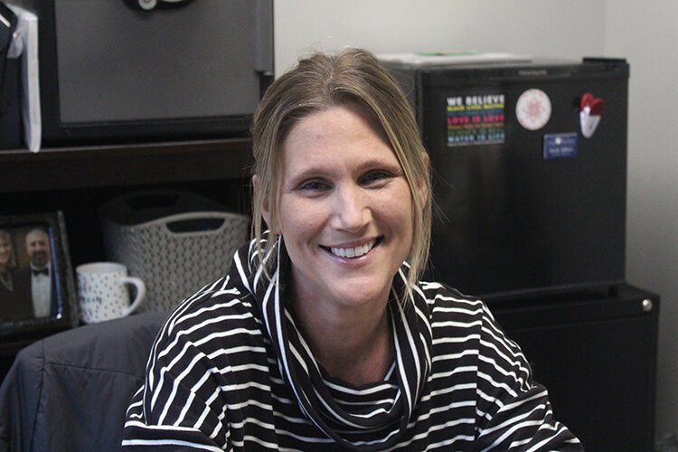 Sarah Adkins poses in her office at the Isabella Community Soup Kitchen. 