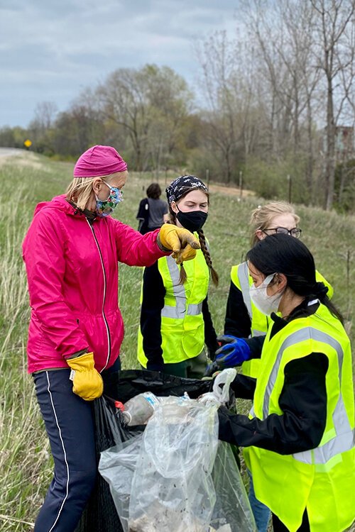 While helping plant trees for the project, volunteers also cleared the area of any trash or debris.