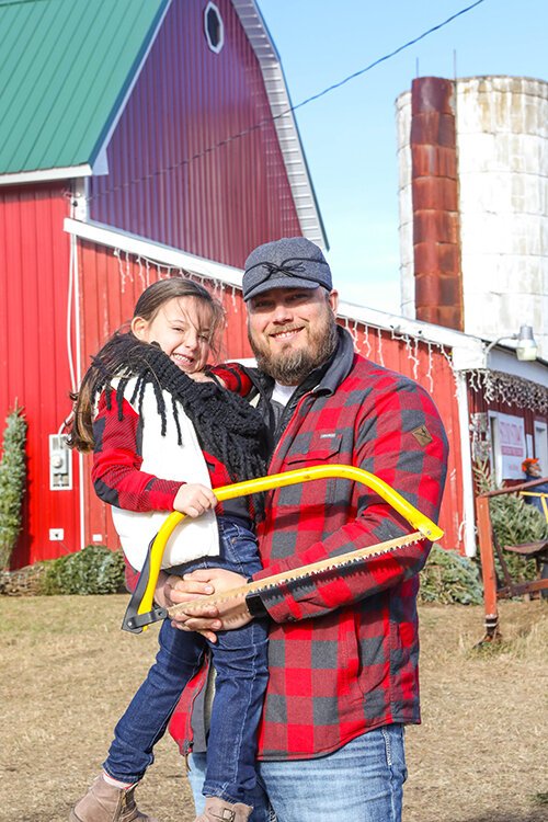 Customers Matthew and Rosie Bednorek come to Swan's Christmas Tree Farm every year to pick out their tree.