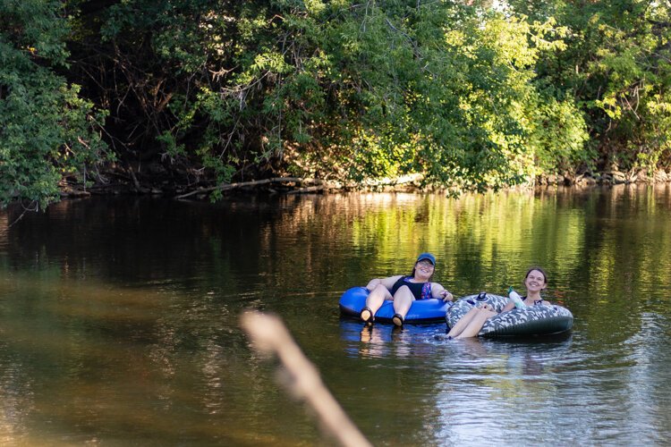 Sara Prusse, 26, of Connecticut tubes down the Chippewa River with a friend.