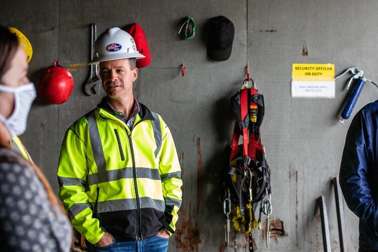 Bay Aggregate Manager Kevin Cotter explains how stevedores move the wind turbines from freighters to trucks at Port Fisher Terminals in Bangor Township.