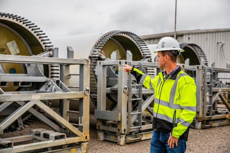 Cotter explains how the root of each blade is attached in the field in order to turn wind into energy.