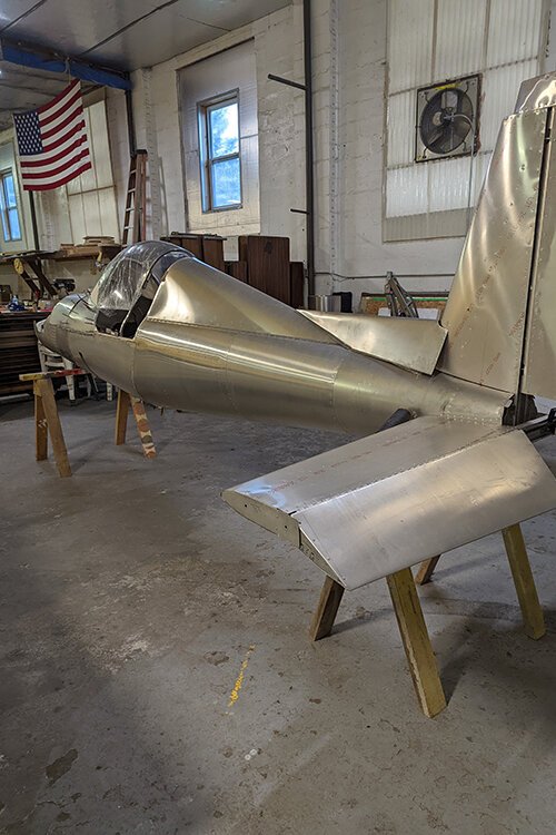 The Young Eagles are nearly finished assembling a Hummel H5 aircraft at Mt. Pleasant Municipal Airport.