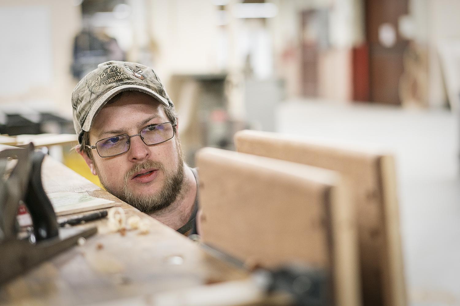 Flint, MI - Friday, February 2, 2018: As he rounds the edges of his project, Flint resident Mike Callahan checks to make sure his progress is even and smooth at Factory Two in Flint.