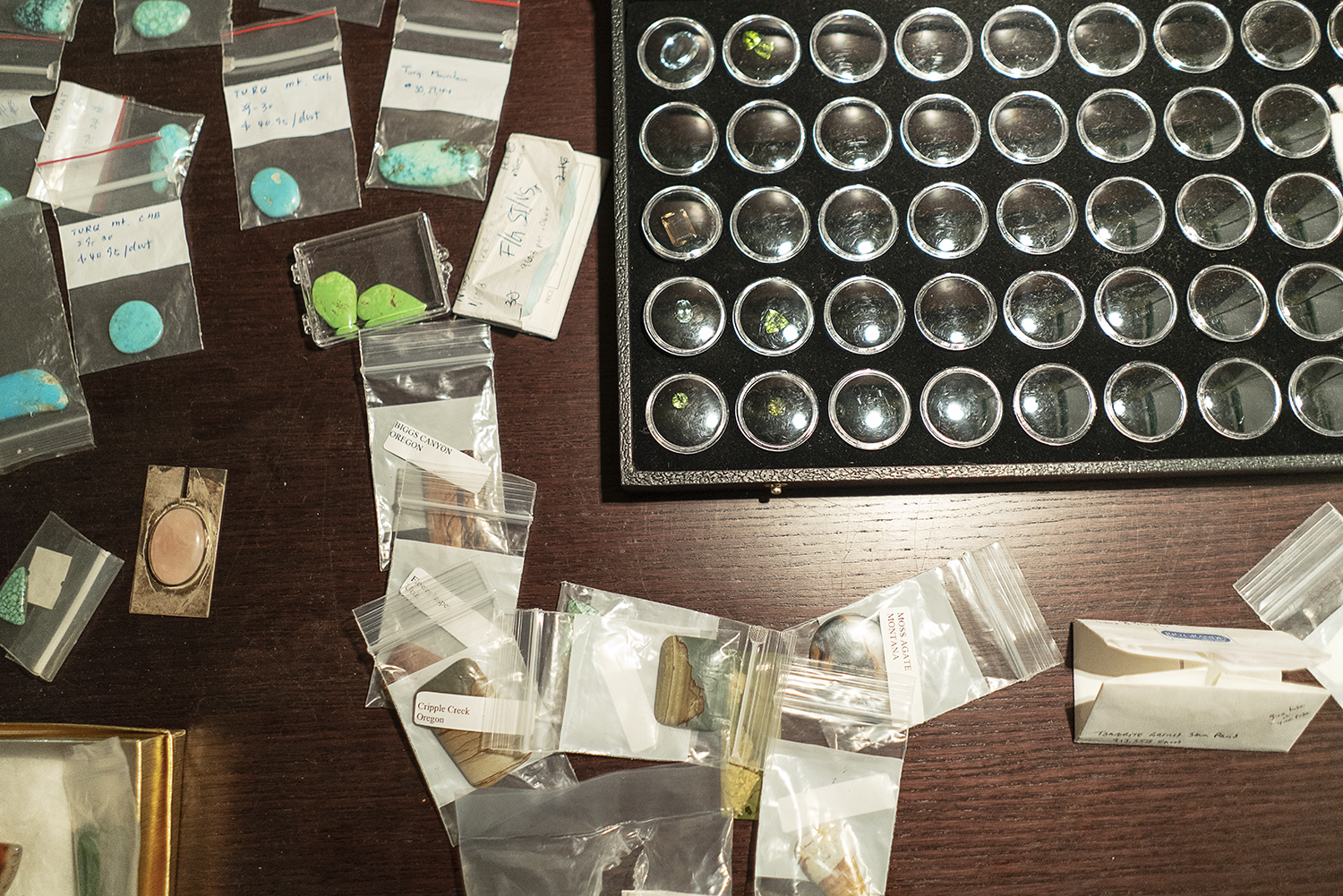 Flint, MI - Tuesday, May 8, 2018: Various stones sit on top of a desk in Robert McAdow's jewelry studio in Flint.