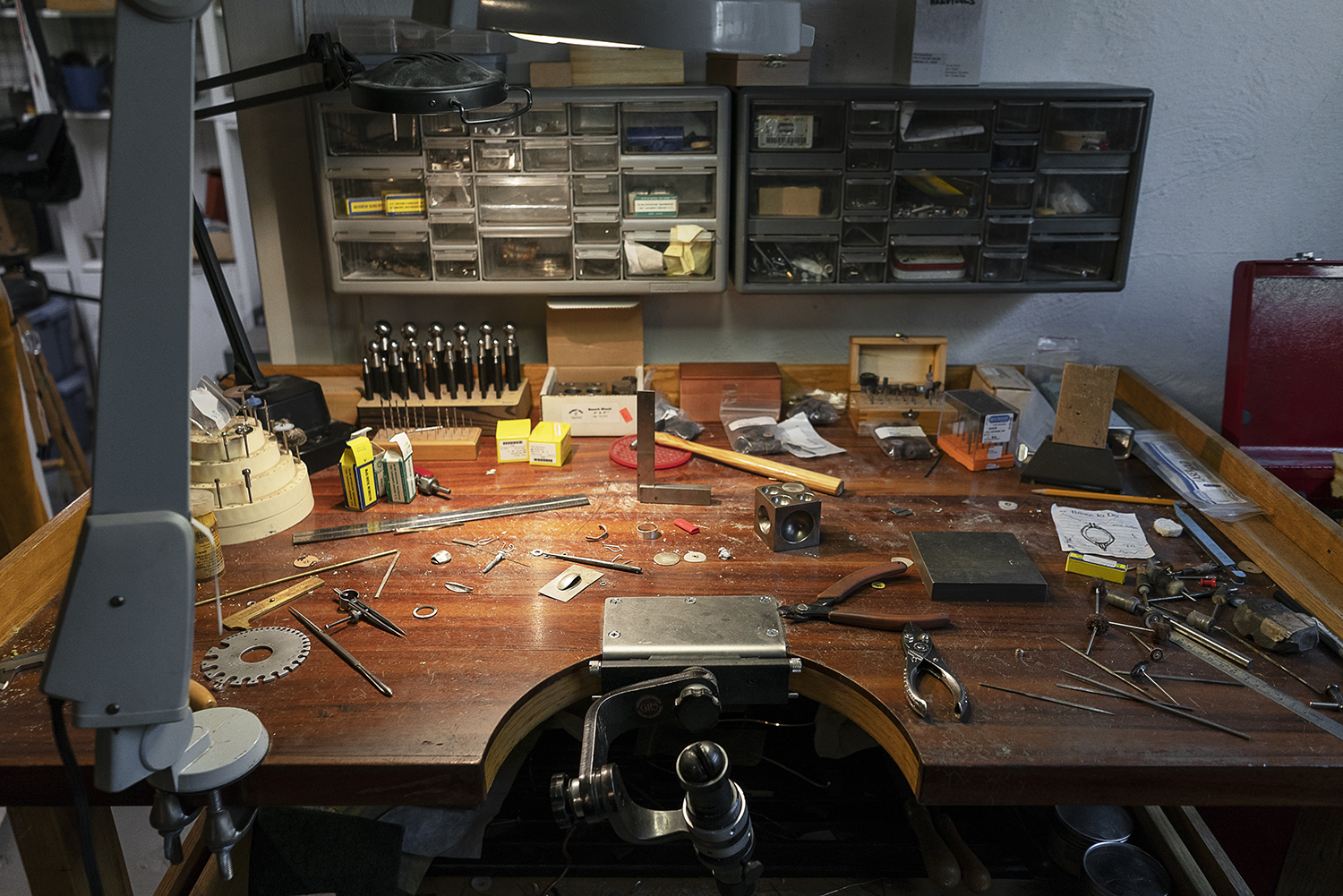 Flint, MI - Tuesday, May 8, 2018: Various pieces of unfinished jewelry and tools rest on a bench in the studio of metalsmith Robert McAdow.