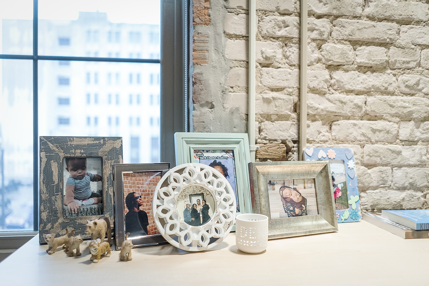 Flint, MI - Thursday, November 2, 2017: Photographs of Denise Smith's family adorn a file cabinet in her office at the Community Foundation Building in downtown Flint. Smith, 55, of Detroit is the Executive Director of the Flint Early Childhood Colla