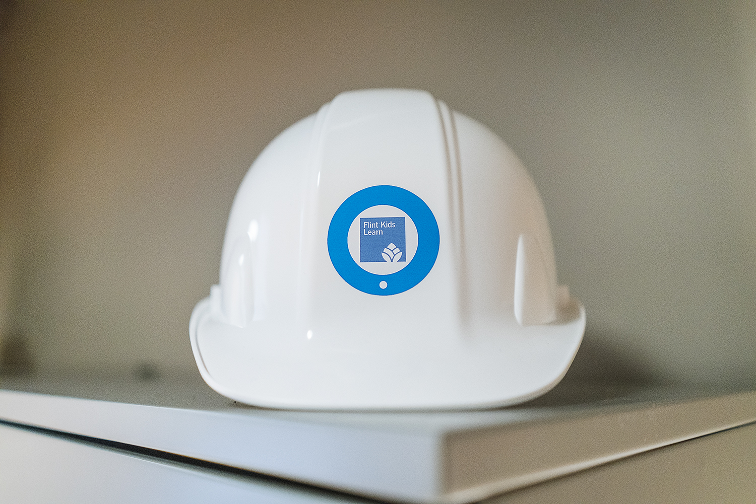 Flint, MI - Thursday, November 2, 2017: A hardhat sits on top of Denise Smith's desk in her office at the Community Foundation Building in downtown Flint. Smith, 55, of Detroit, continually pushes her education to have the best available tools in her