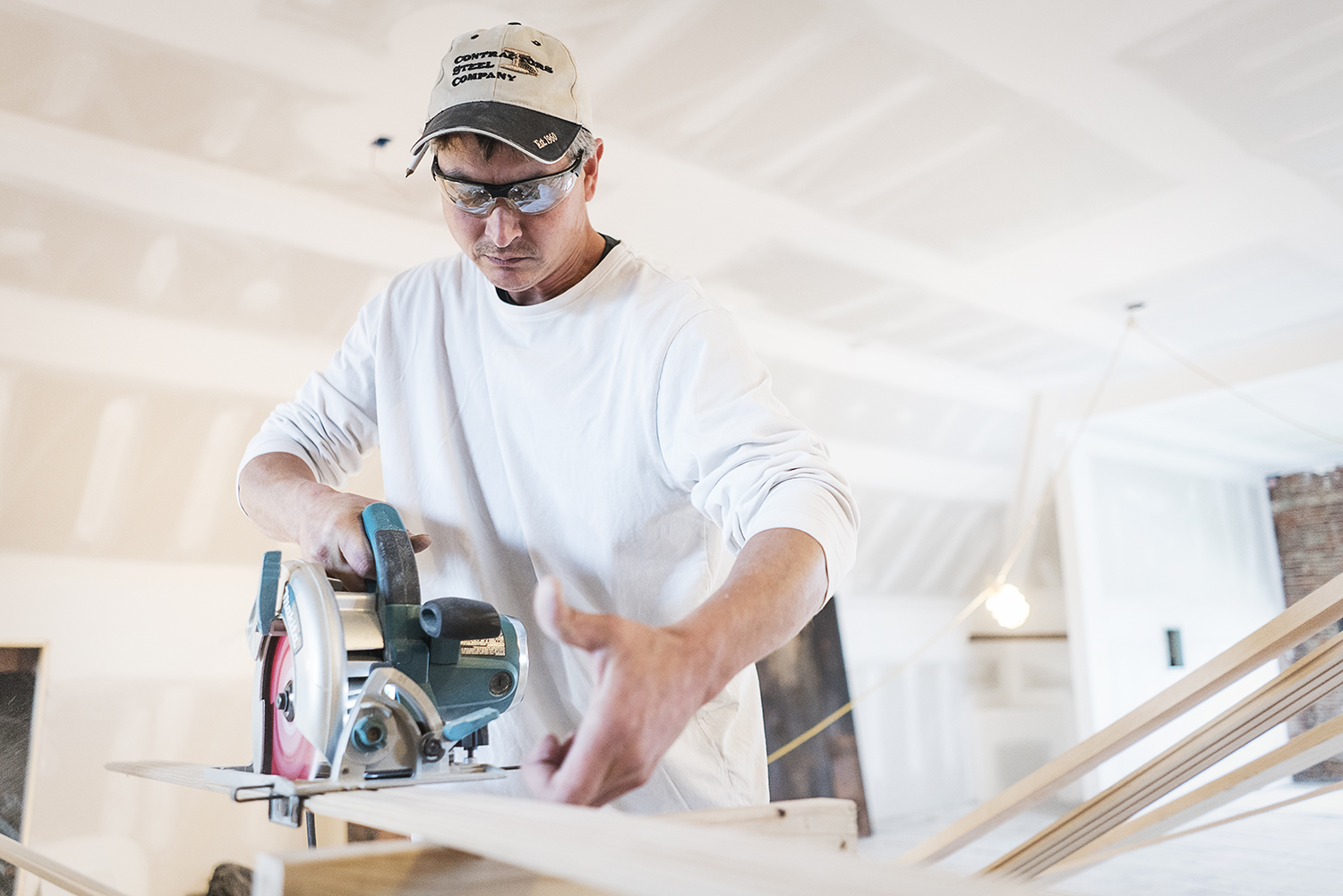 Flint, MI - Tuesday, October 31, 2017: Carpenter and Oxford resident Rob Smith, 43, rips a piece of bead board to hang on the wall on the third floor of the Whaley Historic House Museum. Smith, specializing in detailed finish carpentry, has been work