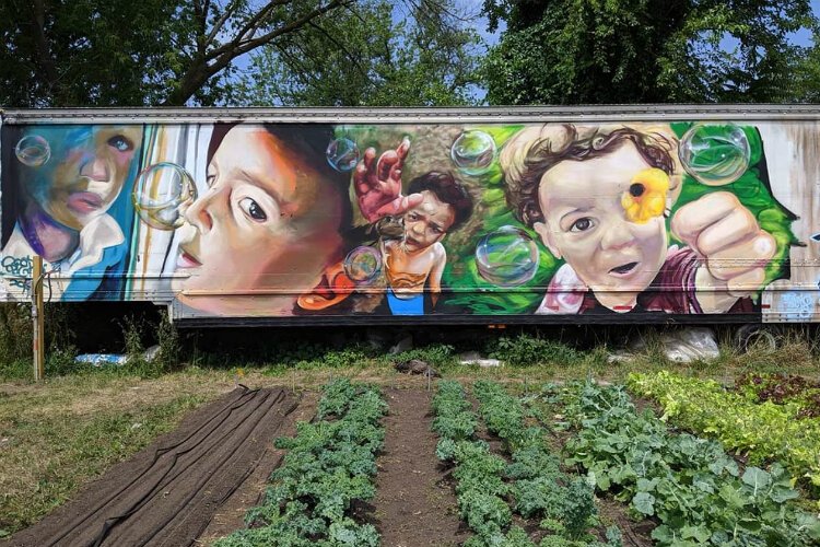 Isiah Lattimore-Balicki created this mural at 1605 Jane Avenue, adding even more life to the garden project there.