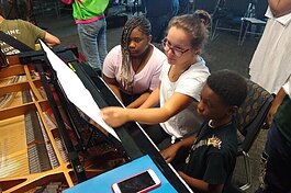 MSU Community Music School students in Detroit get ready to practice piano