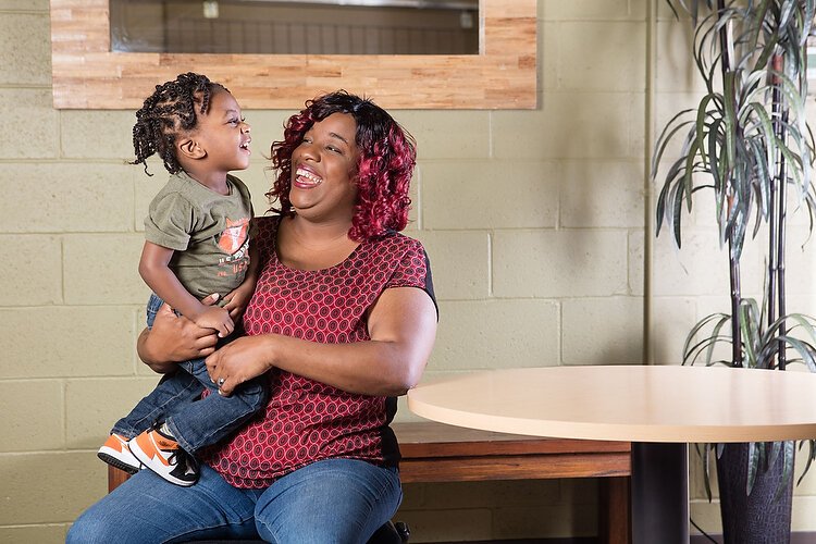 Shontaze Jones and her son E'Daniel Smith Jr. have improved their lives with help from Community Rebuilders. 